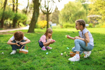 Poster - Easter celebration. Cute little children hunting eggs outdoors