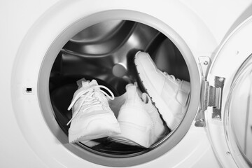 Poster - Stylish clean sneakers inside modern washing machine