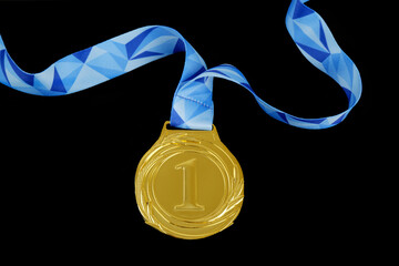 Wall Mural - Gold medal isolated with blue ribbon on black background.	