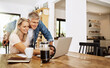 © peopleimages.com - Mature, couple and retirement research on laptop planning finance, real estate or reading news online. Banking, investment and people with talking of asset management in home with document or review