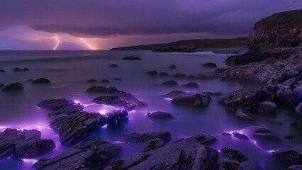 Wall Mural - a rocky beach with small coves lit up by violet flames dancing on the waters surface.