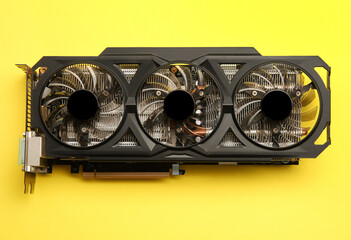Poster - One graphics card on yellow background, top view