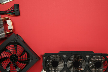Poster - Graphics card and other computer hardware on red background, flat lay. Space for text