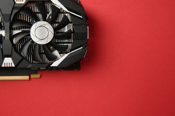 Poster - Computer graphics card on red background, top view. Space for text