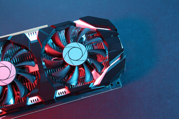 Poster - Computer graphics card on color background, top view. Space for text