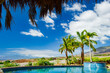 © Andrew Kornylak - Poolside view with blue skies and palm trees in Lahaina, Maui, Hawaii, in 2010