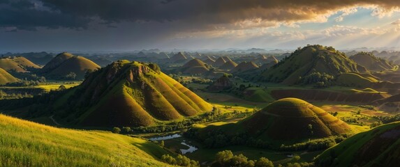 Sticker - Rolling green hills and valleys glow under the dramatic evening light, accentuated by the setting sun and clouded sky