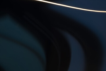 Wall Mural - a black and white photo of a dark blue line with a yellow line on it. the photo has a moody and myst