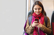 © Niks Ads - young beautiful indian woman holding smart phone