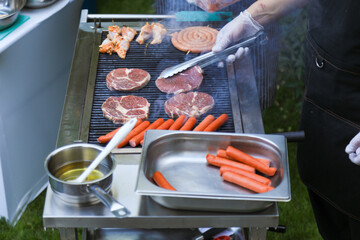 Grilling variety of meats on BBQ