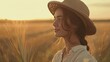 © yanadjan - Woman portrait in a hat on the field. Selective focus.
