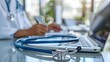 © Hool - Doctor's laptop seen the medical background. including the patient's illness history, looking at a laptop screen dashboard.