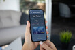 © DenPhoto - woman hands hold phone with air ticket application on screen