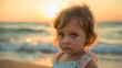 © Nemanja - Closeup of sad unhappy little toddler girl sand beach portrait at the sunset with sea or ocean background. Childhood summer vacation or holiday, alone baby outside, depression, sadness, lonely, cry