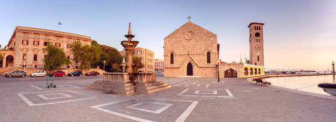 Wall Mural - Panorama of Evangelismos Church and historic fountain in Rhodes, Greece, in the morning