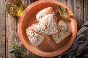 Wall Mural - Cripsy buns made of wheat flour and green olives.