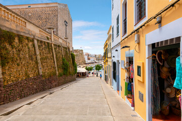 Wall Mural - A long flight of wide steps leading to the historic medieval old town of Ciutadella de Menorca, a whitewashed fishing village on the Mediterranean on the Balearic island of Menorca, Spain.	