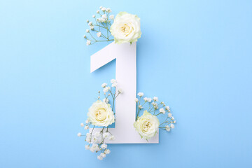 Wall Mural - Paper number 1 and beautiful flowers on light blue background, top view