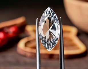 a forceps holding a marquise shape diamond