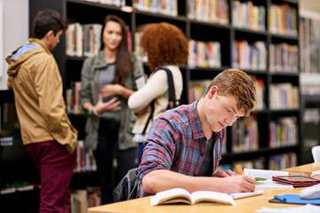 Wall Mural - Student, writing and notebook in library for study, education and university quiz with pen on table. Man, books and knowledge on school campus for college, research and learning with scholarship