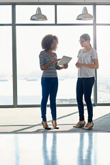 Poster - Creative woman, colleagues and discussion with tablet by window for project, research or deadline at office. Female person, designers or employees talking with technology for ideas, web or startup