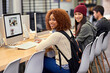 © peopleimages.com - Portrait, computer and students in library for research, studying and youth in university for knowledge. College, friends and girls with smile, typing and monitor for project, exam and scholarship