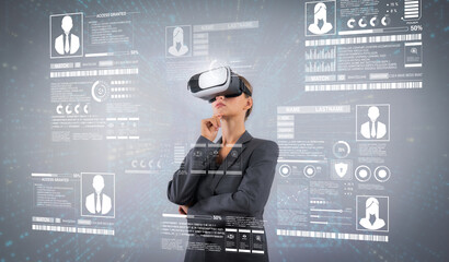 Wall Mural - Project manager looking and managing security protection holographic. Professional businesswoman access identity privacy system while standing and wearing VR glasses to enter metaverse. Contraption.
