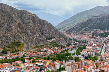 Wall Mural - Fascinating view of the city of Amasya, also known as the city of princes. wonderful clouds coming out of the mountains. YESILIRMAK river.