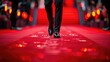 © Boomanoid - A celebrity walks the red carpet. Close-up of legs.