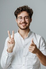 Poster - A man in a white shirt and glasses giving the peace sign. Suitable for various concepts and themes