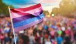 © Arthur - bisexual flag on the background of the pride parade, lgbt pride month, fight against homophobia, tolerance, rally of many people