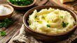 © Boomanoid - Bowl of mashed potatoes with butter and butter pat