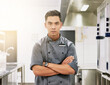 © peopleimages.com - Asian man, portrait and chef with arms crossed in kitchen for professional cooking, hospitality or confidence. Male person, face and fine dining restaurant or service in food industry, career or work