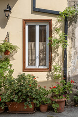  Pano Lefkara village, Larnaka region, Cyprus-May 24, 2024: Stone houses, white walls, narrow cobbled lanes, doors, windows, flowers, flowerpots, billboards, as seen in the village narrow streets 