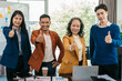 © NINENII - Group of Young Asian business team creative businesspeople coworker in office Happy to be successful partnership teamwork success concept.