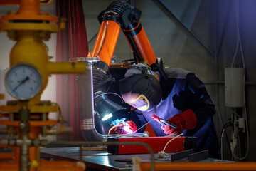 Poster - Man welder. Soldering equipment in hands of guy. Welder at work. Industrialist works with welding. Welder in protective mask. Metal processing plant. Soldering apparatus of man worker.