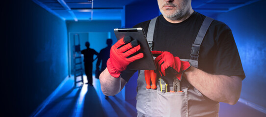 Poster - man foreman. construction worker with tablet computer. cropped foreman uses gadget. builder uses int