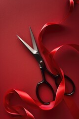 Poster - A pair of scissors resting on a vibrant red ribbon, suitable for various projects
