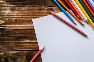 Aufkleber - Colorful pencils and paper on a rustic wooden table, suitable for education or art concepts