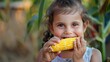 © Артур Комис - close-up of a child eating corn. Selective focus