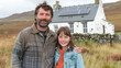 © Neuroshock - Happy family in the background of their home with solar panels on the roof