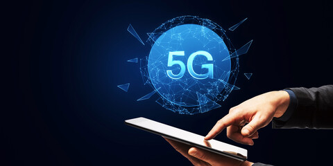 Aufkleber - Hand holding a tablet with a glowing 5G network hologram emanating from the screen on a dark blue background, embodying the concept of modern connectivity