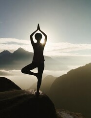 Wall Mural - Silhouette of Woman Practicing Yoga on  Mountain Peak