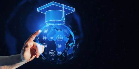 Aufkleber - A hand pointing at a digital hologram of a graduation cap over a globe, on a networked blue background, concept of global education
