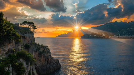 Wall Mural - Amalfi coast cliff with sunset with beams of light.