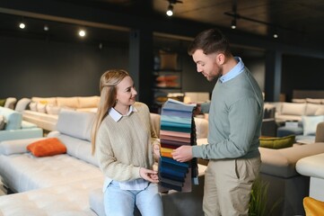 Wall Mural - Couple choosing sofa in furniture store