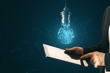 Aufkleber - A person holding a tablet with a holographic light bulb above it, against a dark blue network background, symbolizing innovative ideas