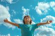 © -=RRZMRR=- - relaxed boy breathing fresh air raising arms over blue sky