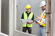 © DG PhotoStock - Engineer team discuss and examine a building construction.