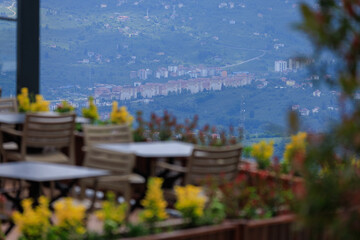 Wall Mural - Beautiful views from above, tables in a cafe in the mountains and a panoramic view of the city, public places in Turkey, on a sunny summer day